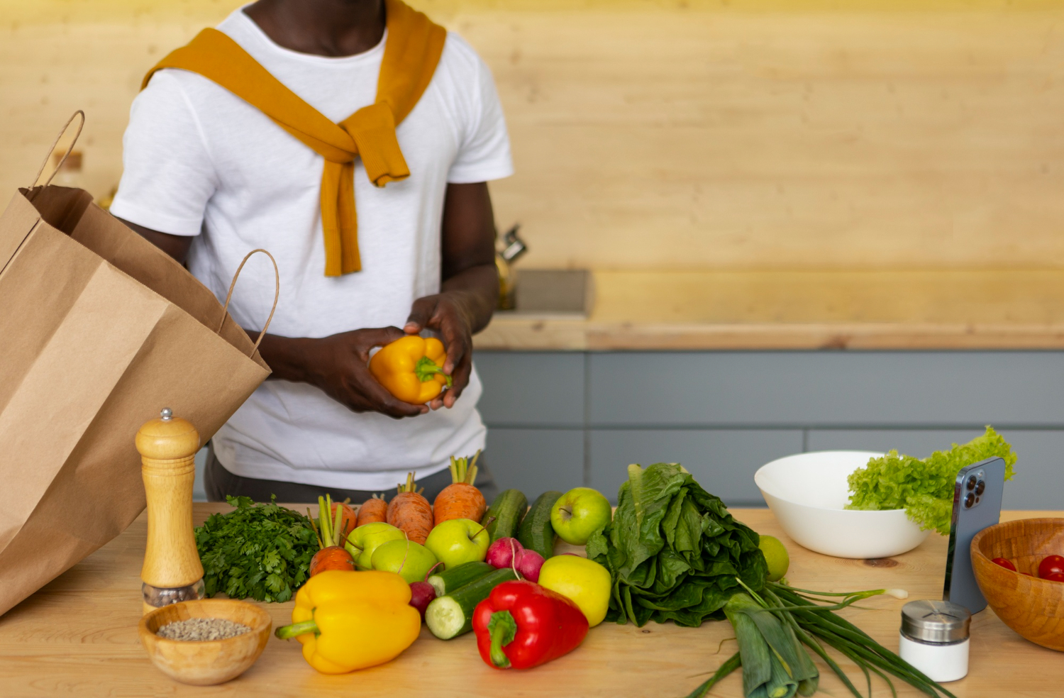 front-view-man-cooking-with-smartphone